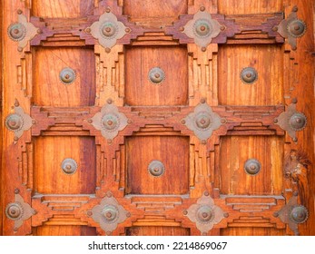 Wooden Background Of Ancient Old Carved Wood Door And Work With Metallic Ornaments