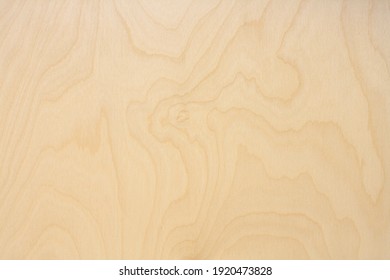 Wooden background made of birch plywood with natural texture and pattern