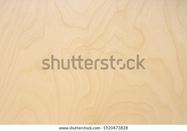 Wooden background made of birch plywood with\
natural texture and\
pattern