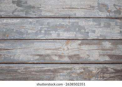 Wooden background. The picture shows a background made of an old cracked wooden board, which looks very expressive and authentic.