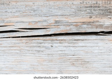 Wooden background. The picture shows a background made of an old cracked wooden board, which looks very expressive and authentic.