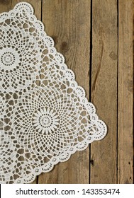 Wooden Background With White Lace Napkin