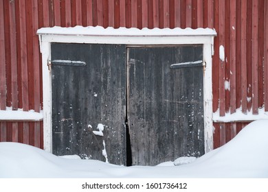 Wooden Barndoor In The Snow