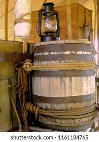 Wooden barrel and gas lantern at an historical reenactment.