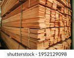 Wooden bars stacked in the warehouse of a lumber company