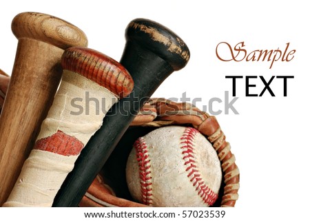 Wooden baseball bats with ball and glove on white background with copy space.  Macro with shallow dof.  Focus on taped handle.