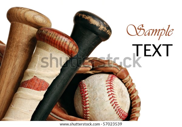 Wooden baseball bats with ball and glove on white\
background with copy space.  Macro with shallow dof.  Focus on\
taped handle.