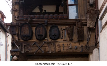 Wooden Bay Window With Exhibited Wine Barrels And Winemaking Tools 
