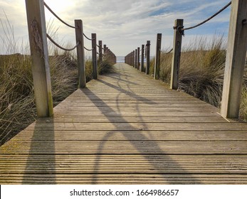 Wooden Beach Path With Rope Fence, Leading To Ocean. Low Angle.