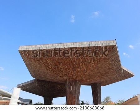   Wooden beach umbrella Lookup blue sky in summer. Holiday by the sea