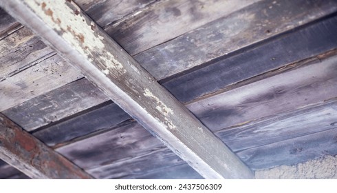 Wooden beams, attic. Part of the reconstruction of an ancient castle tower. Wooden roof elements