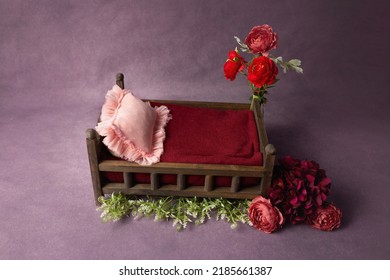wooden bed decorated with roses. props for newborn photography. furniture for dolls. interior with flowers
