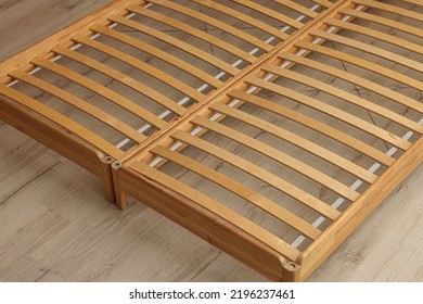 Wooden Bed Frame On Floor, Closeup View