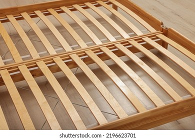 Wooden Bed Frame On Floor, Closeup View