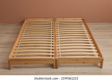 Wooden Bed Frame On Floor In Room