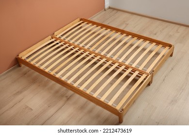 Wooden Bed Frame On Floor In Room