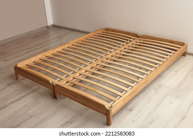 Wooden Bed Frame On Floor In Room