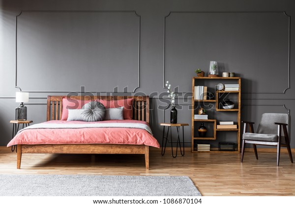 Wooden Bed Pink Bedding Against Grey Stock Photo Edit Now 1086870104