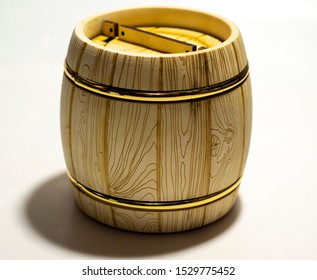 Wooden Beige Barrel With A Golden Hoop For Honey Or Wine On A White Background, Side View