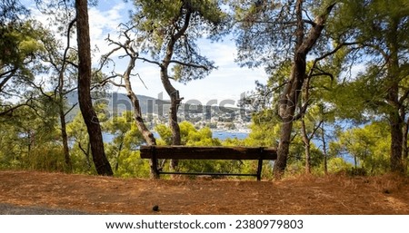 Wooden bench against to panoramic view on the shore of Heybeliada Prince islands Istanbul Turkey.