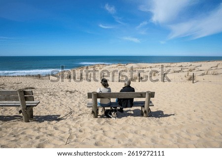 wooden bench couple sitting senior beach in panoramic atlantic coast sea in carcans french southwest