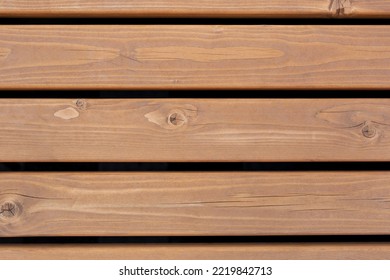 A wooden bench made of planks (top view) for the background. Wooden texture