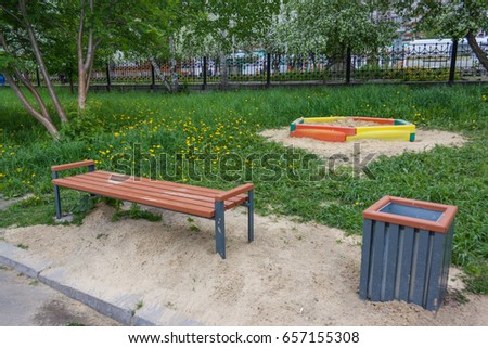 A wooden bench in the park a summer sunny day