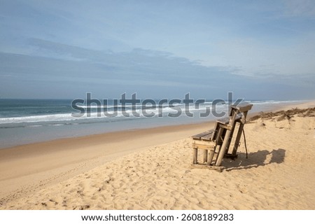 wooden bench sand along sea atlantic ocean beach le grand crohot in lege cap-ferret in french coast