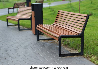 wooden benches in the park after the rain