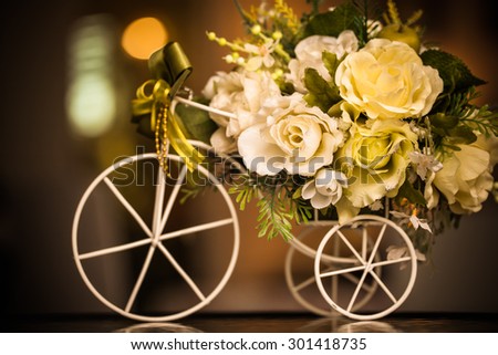 Wooden bicycle toy for decorative with artificial flowers