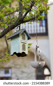  Wooden bird house as decoration in a tree in the garden                              