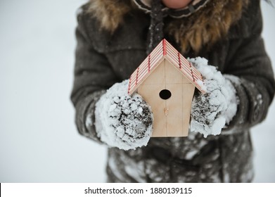 Wooden bird house with a roof. The concept of winter and the house. - Powered by Shutterstock