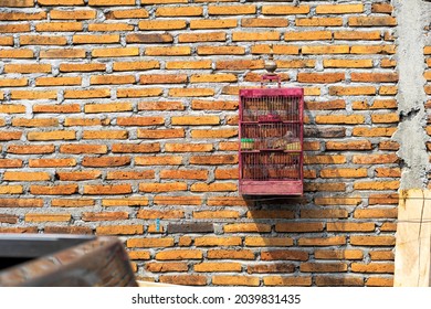 Wooden Birdcage On Vintage Brick Wall