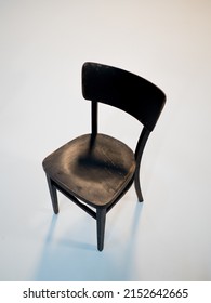 Wooden Black Antique Chair On A White Cyclorama