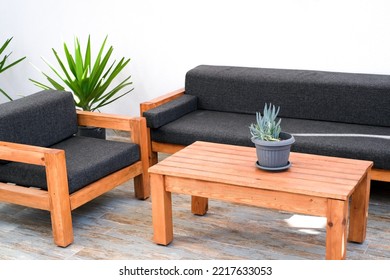 Wooden And Black Sofa Set With Coffee Table, Close Up. Garden Furniture.