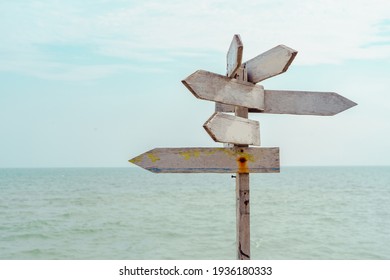Wooden blank sign white color with sea and blue sky. - Shutterstock ID 1936180333