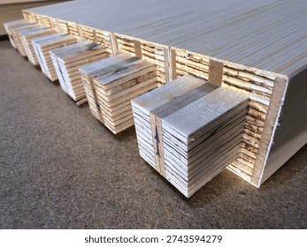 wooden blanks for assembling durable structures from compound materials in close-up. space for text.