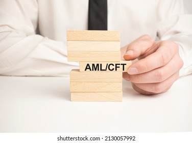 Wooden Block With Aml Cft On The Table