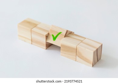 wooden block with check mark on white background - Shutterstock ID 2193774521