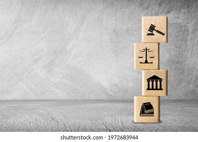 Wooden block cube shape with icon law legal justice on a desk - Shutterstock ID 1972683944