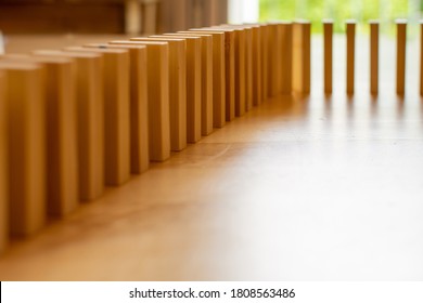 Wooden Block Domino Standing Stable On Wood Table, Business Chain And Connection Symbol, Domino Effect Theory