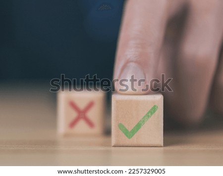 wooden block showing right and wrong sign decision concept, vote and think yes or no Business options for difficult situations true and false symbol