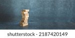 Wooden block stack concept of prevent collapse or crash of financial business and risk management or strategic planning and insurance.