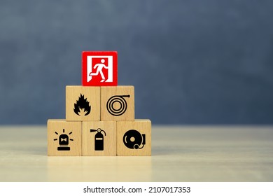 Wooden Block Stack With Fire Prevention Icon With Door Exit And Fire Extinguisher And Emergency Protection Symbol For Safety.