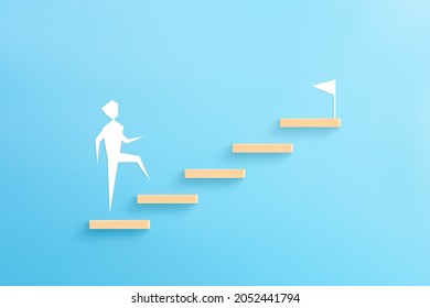 Wooden Block Stacking As Step Stair With Businessman Icon On Blue Background, Ladder Of Success In Business Growth Concept