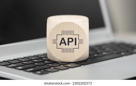 Wooden block with symbol of api concept on laptop keyboard - Shutterstock ID 2302202571