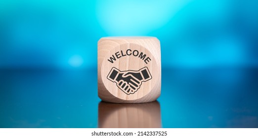 Wooden Block With Symbol Of Introduction Concept On Blue Background