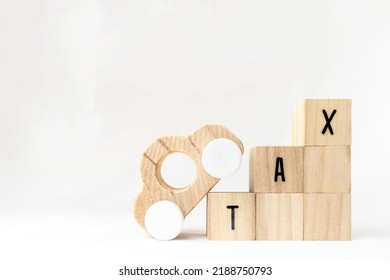 Wooden Block Tax And Toy Car. Image Of Tax Increase