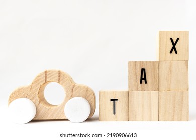 Wooden Block Tax And Toy Car. Image Of Tax Increase