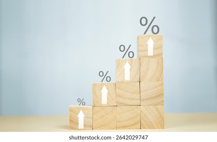 Wooden blocks arranged as a rising staircase with percent signs and arrows, representing interest rates, revenue growth, and business success.